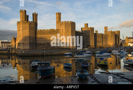 Sunset over Caernarfon Castle Caernarfon Gwynedd North Wales Stock Photo