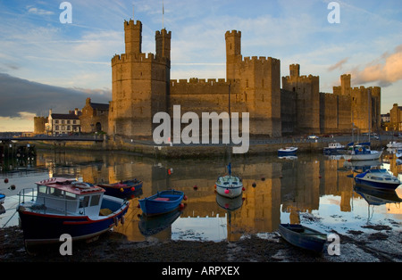 Sunset over Caernarfon Castle Caernarfon Gwynedd North Wales Stock Photo