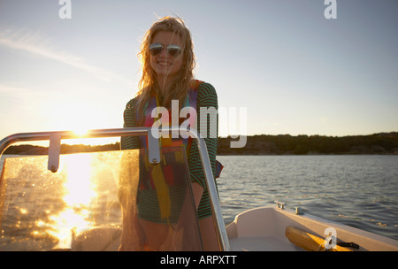 Young Woman in speedboat Stock Photo