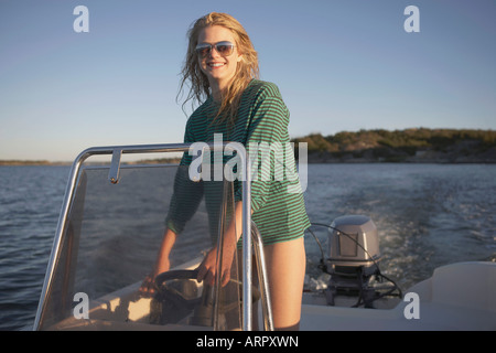 Young Woman in speedboat Stock Photo