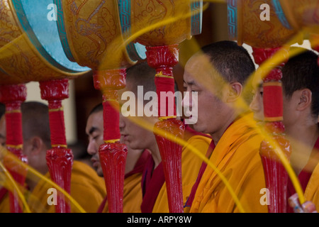 Tibetan Buddhist monks using traditional meditation instruments.  close up landscape Stock Photo