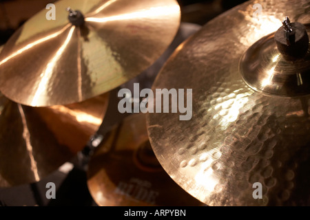 Rock band Status Quo drummer's Zildjian cymbal instruments shine under lights on stage during the group's European tour Stock Photo