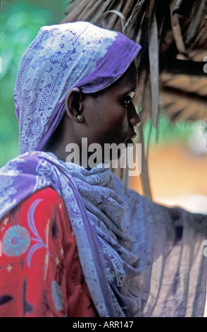 AFRICA KENYA KALIFI Beautiful young African Muslim woman with pierced nose wearing head scarf of purple kanga cloth Stock Photo