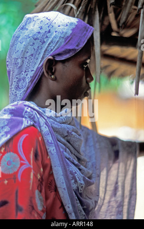 AFRICA KENYA KALIFI Beautiful young African Muslim woman with pierced nose wearing head scarf of purple kanga cloth Stock Photo