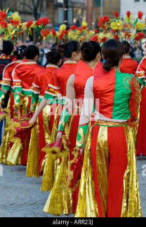 Chinese teenage girls dancers performing in the Chinese new year celebration in Albert Square Manchester city Centre UK Europe Stock Photo