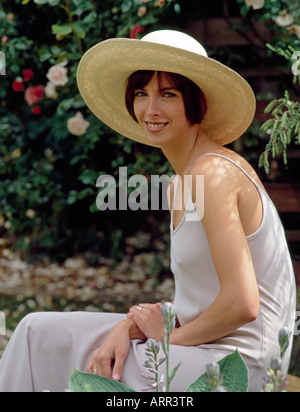 Young woman in straw hat Stock Photo