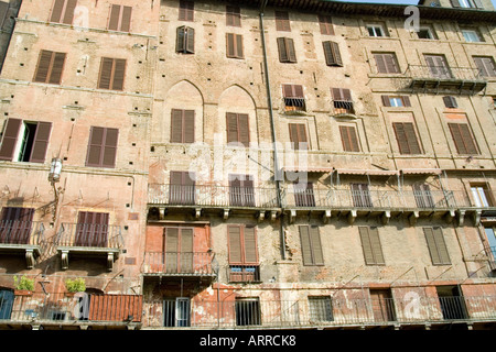 Siena Tuscany Italy ancient walled Gothic city il campo, buildings with shuttered windows Stock Photo