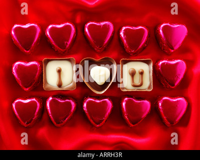 I Love You written in heart shaped red chocolates Stock Photo