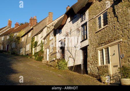 Gold Hill made famous by Hovis Advertisement in Shaftesbury Dorset England Edge of Town Housing Wintertime landscape Stock Photo