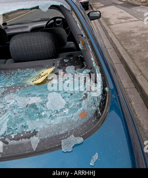 Broken Car window, in residential street, West Yorkshire, Northern England Stock Photo