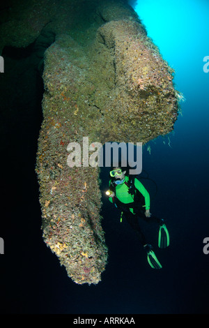 nr0682D. scuba diver, Model Released, explores stalactites130 feet deep in The Blue Hole. Belize. Copyright Brandon Cole Stock Photo