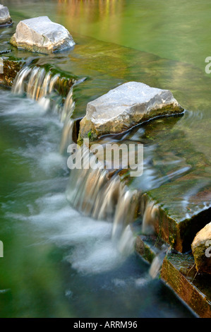 Small waterfall, Jubilee Park, Canary Wharf Estate, London, United Kingdom Stock Photo