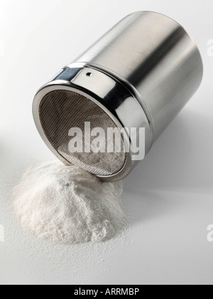Flour shaker on a white background editorial food Stock Photo