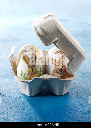 Hand Painted Easter eggs illustrated with Easter bunnies Stock Photo