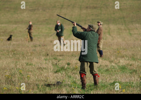 Shooting party take aim English countryside Stock Photo