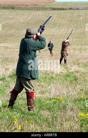 Shooting party take aim English countryside Stock Photo