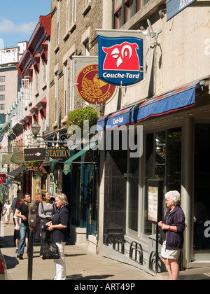 Tourists walking along a street, on a bright and sunny summer day in Quebec City, Canada Stock Photo