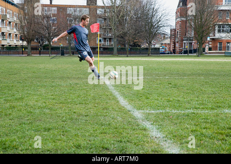 Footballer taking a corner Stock Photo