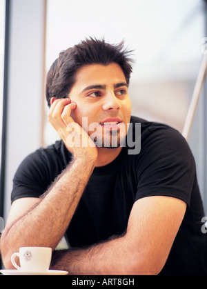 Arab man having a cup of coffee Stock Photo
