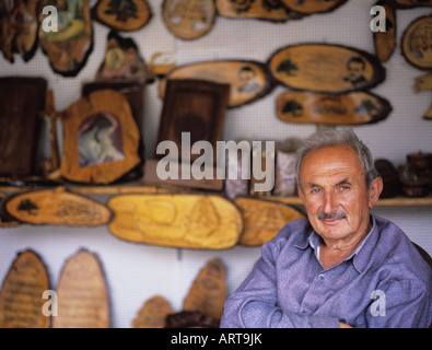 Old man selling souvenirs made of cedar trees, Lebanon Stock Photo