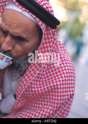 Hijazi merchant drinking coffee in Bab Makkah, Jeddah, Saudi Arabia Stock Photo