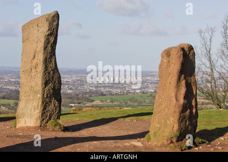 Two of the Four Stones Clent Hills with the tower blocks of Brierley Hill Dudley in the distance. Stock Photo