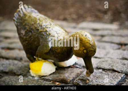 Make Way for Ducklings statue wearing yellow shoes in the Boston Public Garden Boston MA USA Stock Photo