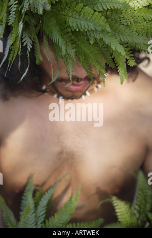 Male (kane) hula dancer deep in thought, wearing palapalai fern head lei, headshot. Stock Photo