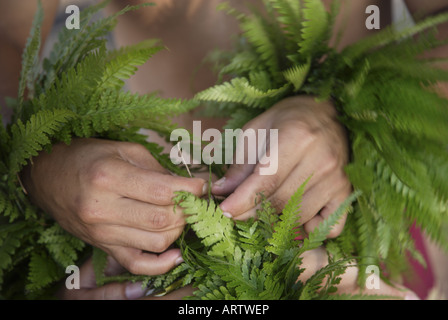 Male (kane) hula dancer deep in thought, wearing palapalai fern head lei, headshot. Stock Photo