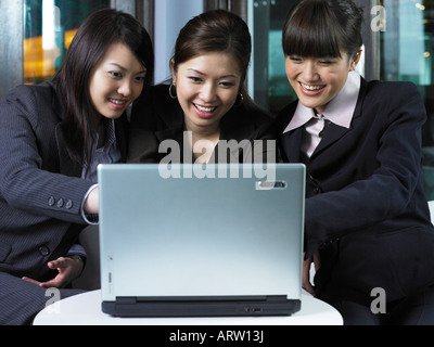 three businesswomen on laptop Stock Photo