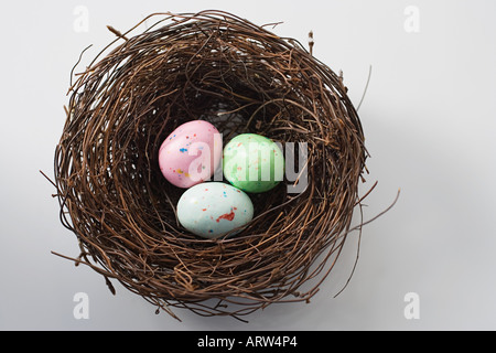 Colourful eggs in a nest Stock Photo