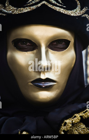 Portrait of a person dressed in Carnival costume and gold mask Venice Carnival Veneto Italy Stock Photo