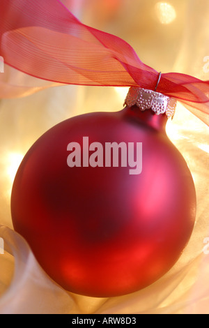 Red Christmas ornament against a silky background Stock Photo