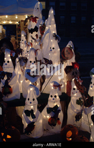 A display of cheery Halloween ghosts lights up the night at the annual Pumpkin Festival in Keene NH Stock Photo