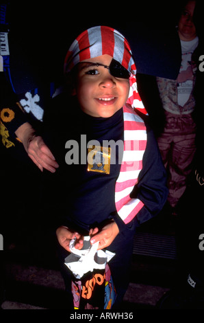 Boy age 6 trick or treating in pirate costume on Halloween night. St Paul Minnesota USA Stock Photo