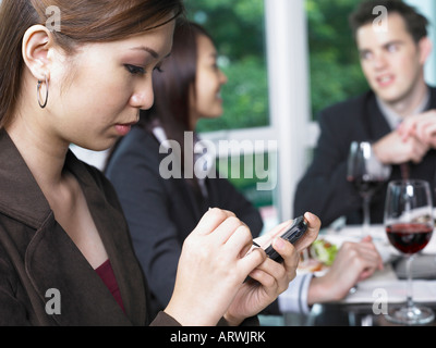 Businesswoman Using PDA Stock Photo