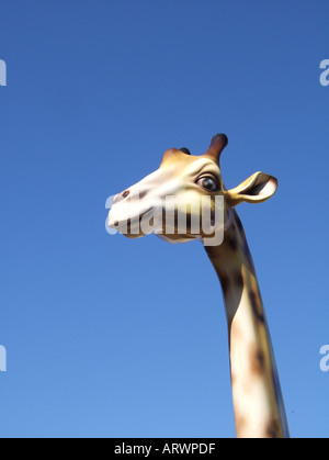 model giraffe's head and blue sky Stock Photo