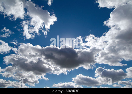 Sky filled with small white puffy clouds against a blue sky give a religious tone Stock Photo