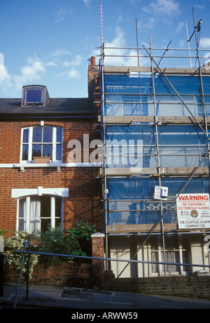 Victorian terrace public housing one in scaffolding Camden Council refurbishment Kentish Town North London UK Stock Photo