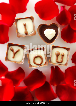 I Love You written in heart shaped red chocolates Stock Photo
