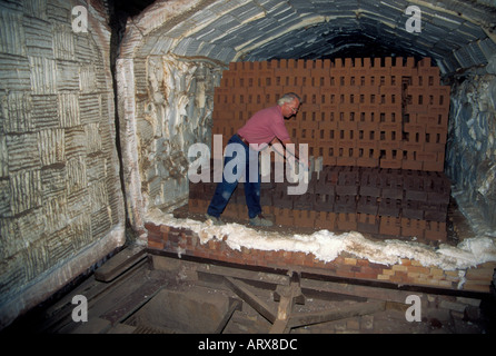 Brick made by hand in a traditional way from local clay in the Forest of Dean,being stacked in a kiln to bake them. Stock Photo