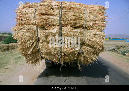 overloaded truck on highway rajasthan india Stock Photo