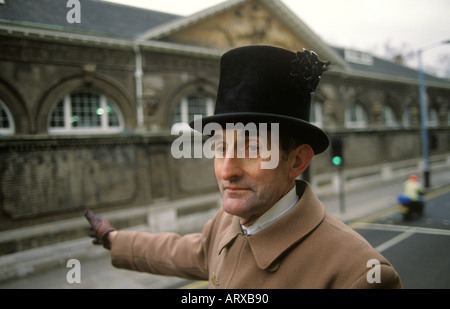 Royal Mews Driver of a Royal carriage signals to turn into the Royal Mews at Buckingham Palace London England 1991 1990s UK HOMER SYKES Stock Photo