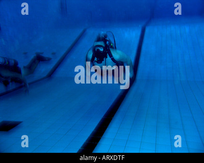 Practise underwater rescue in  swimmingpool Stock Photo