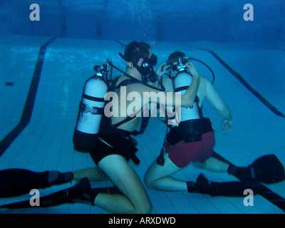 Practise underwater rescue in  swimmingpool Stock Photo