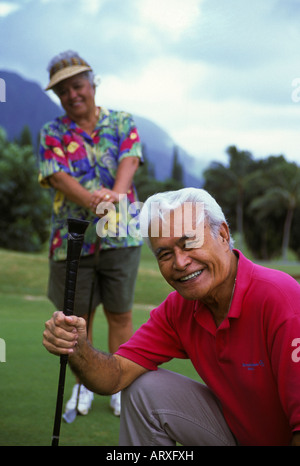 Senior Hawaiian man  and part-Hawaiian woman at Pali Golf Course, Windward Oahu Stock Photo