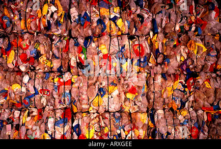 Multicolored bales of crushed consumer plastic containers to be recycled into traffic cones and barricades in Brooklyn NY Stock Photo