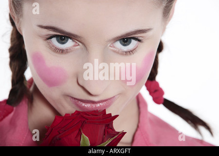 studio shot portrait isolated on white background of a young romantic blushing heart girl Stock Photo