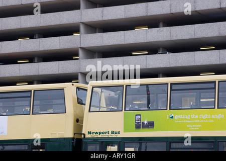 Double decker buses and the multi storey car park in Newport city centre Stock Photo