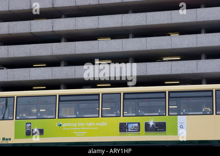 Double decker buses and the multi storey car park in Newport city centre Stock Photo